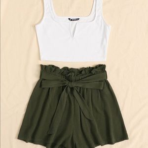 Notched neck tank top and paper bag waist shorts.